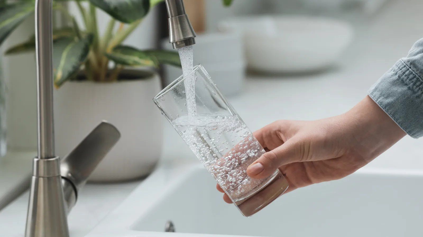 Fresh filtered water being poured into a glass