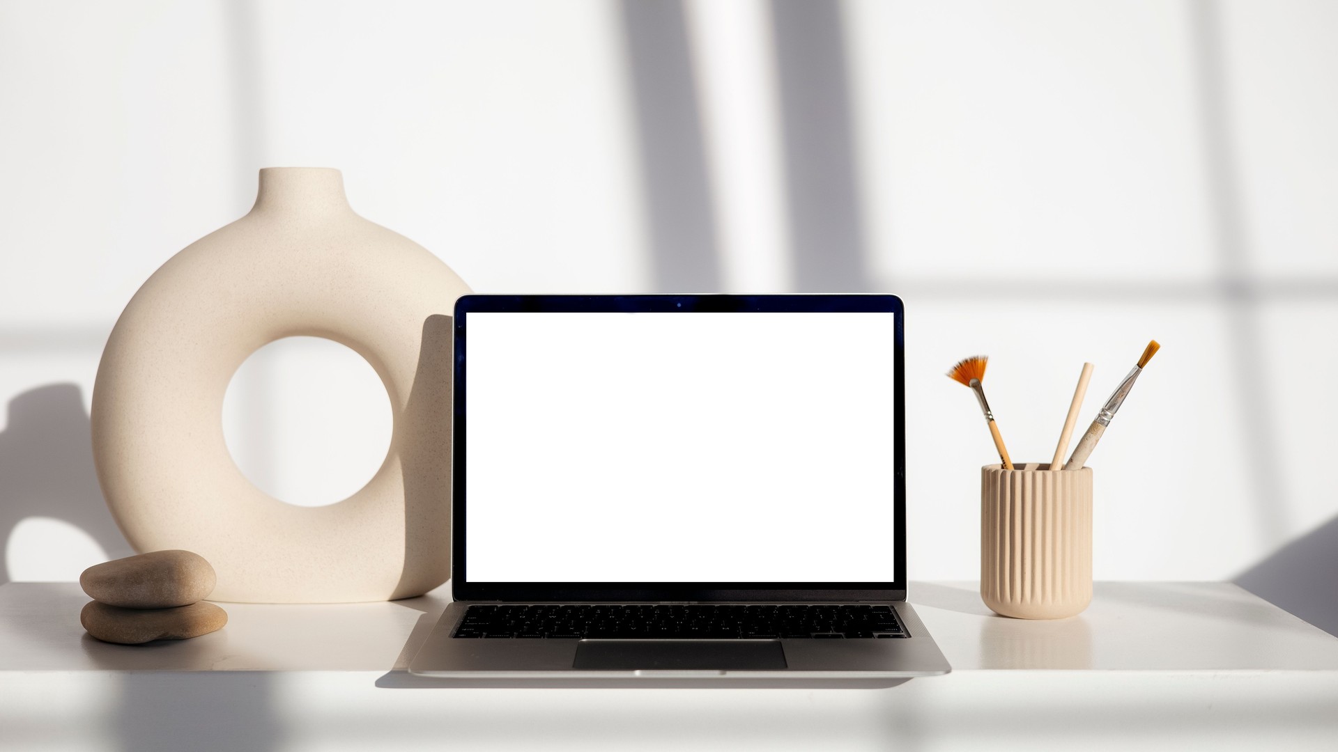 Clean workspace desk with a laptop