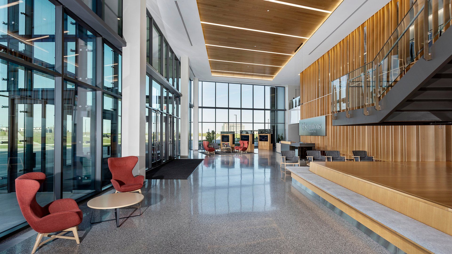 Bright, glass-walled commercial building lobby