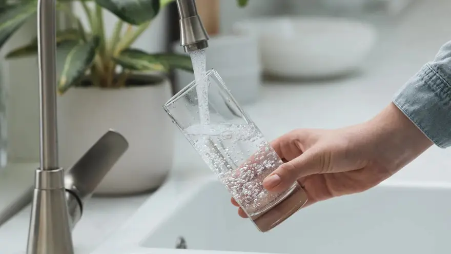 Fresh filtered water being poured into a glass